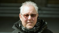Two paralyzed British men who want to die but cannot kill themselves went to court on Monday seeking protection from prosecution for those who could help them end their lives.